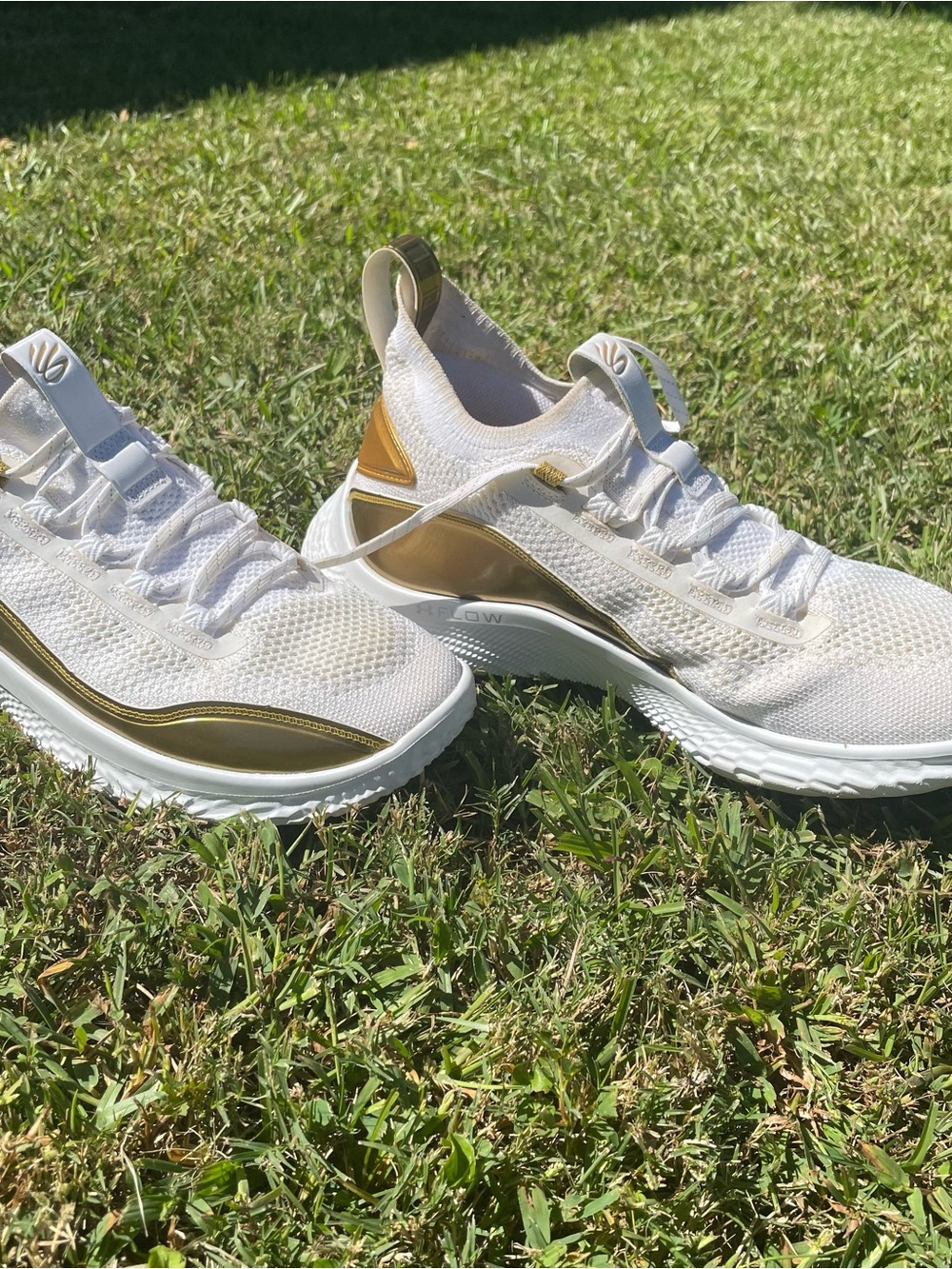 Curry 11s gold and white